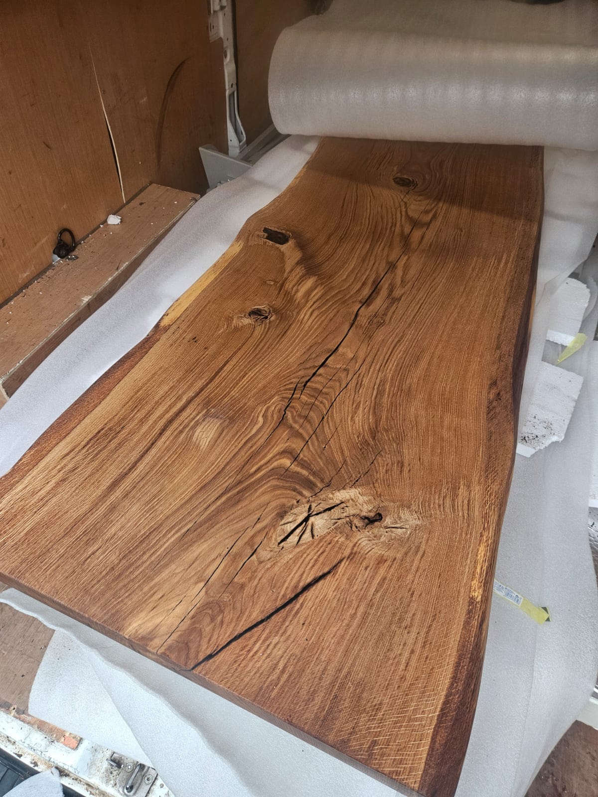 Artisan working with oak slab